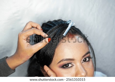 Similar – Image, Stock Photo Professional female master fixing wheel of motorbike