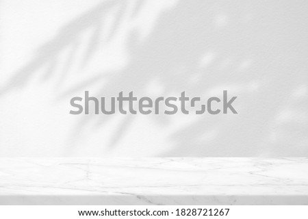 Marble Table with Leaves Shadow on Stucco Wall Texture Background, Suitable for Product Presentation Backdrop, Display, and Mock up.