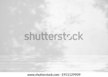 White Wood Table with Bamboo Tree Shadow on Concrete Wall Texture Background, Suitable for Product Presentation Backdrop, Display, and Mock up.