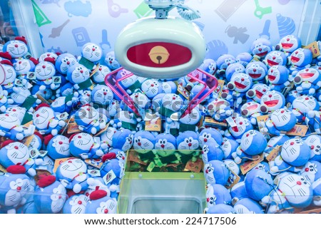HOKKAIDO, JAPAN - OCTOBER 13: Doraemon dolls in toy crane machine  on October 13, 2014 at Chitose international Airport. The Doraemon manga series in Japan was published in December 1969.