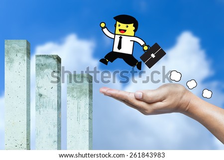 Business man jumping from hand to cement bar chart.