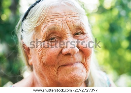 Similar – Image, Stock Photo Portrait of very old farmer with straw hat explaining life in front of a red tractor.