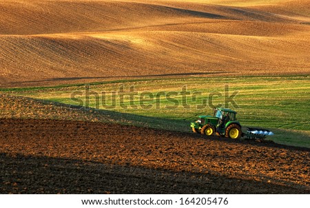 Similar – Image, Stock Photo Farm field is planted with agricultural plants. Watering the crop. Agro industry, agribusiness. Farming, european farmland. Traditional irrigation system. Growing and producing food. Rural countryside