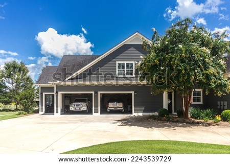 Similar – Image, Stock Photo Three garages in a residential area, one of them is open