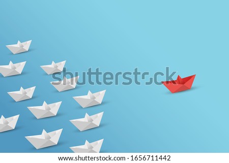 Business competition concept with white and red paper ships on white background.