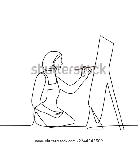 female artist sitting in front of easel with palette and brush in hand - one line drawing vector. the concept the process of the work of the artist