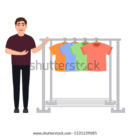 The guy shows off a wardrobe of t-shirts, a man sells t-shirts, a clothes hanger, a character in a cartoon style.