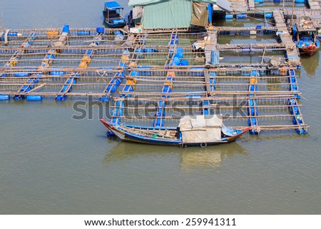 Float fishing village, Long Son, Long Hai, Ba Ria- Vung Tau Vietnam. People living and doing feed fish industry at floating village.