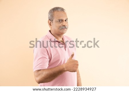 Similar – Image, Stock Photo Old man in good shape running on road along plant fence