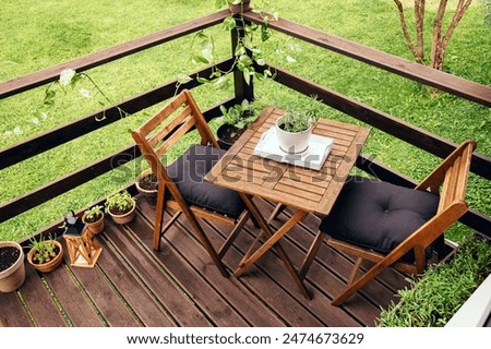 Similar – Image, Stock Photo set garden table with fairy lights in play of light and shadow