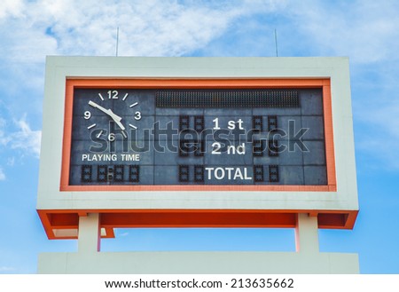 score board at football stadium on blue sky