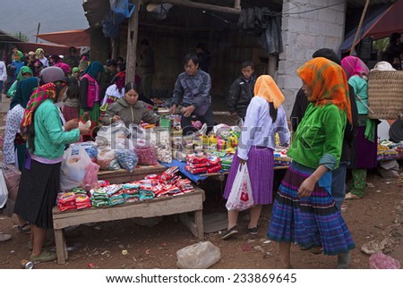 HA GIANG, VIETNAM - NOV 15, 2014: A typical weekly flea market taking place in Lung Phin commune, Dong Van district. Flea market is very popular as one kind of small business in Vietnam.