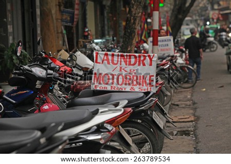 Hanoi, Vietnam - Mar 15, 2015: Advertising sign board of motorbikes for rent. Motorbike is most popular and cheapest transport in Vietnam.