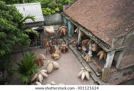 Vietnamese craftsmen making bamboo handicraft products to maintain a traditional handicraft in a countryside of Vietnam. Concept of life in Vietnam