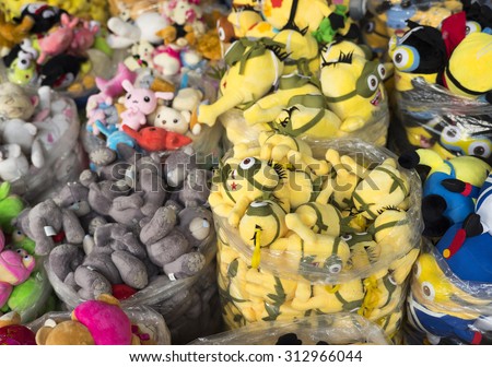 Hanoi, Vietnam - Sep 2, 2015: Colorful made in China minions puppets and teddy for sale at an old street in Hanoi quarter streets area in time of lunar August full moon festival.