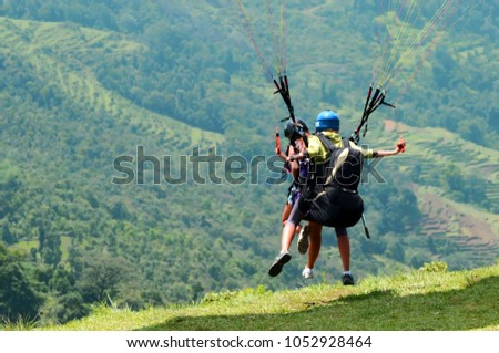 Similar – Image, Stock Photo Fan out the paragliders