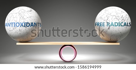 Antioxidants and free radicals in balance - pictured as balanced balls on scale that symbolize harmony and equity between Antioxidants and free radicals that is good and beneficial., 3d illustration Imagine de stoc © 