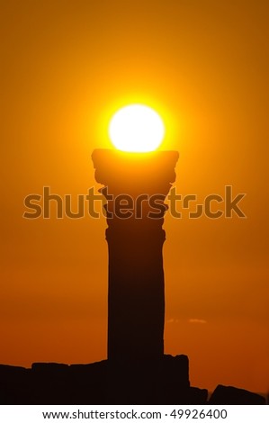 Clear greek roman column silhouette at sunset.