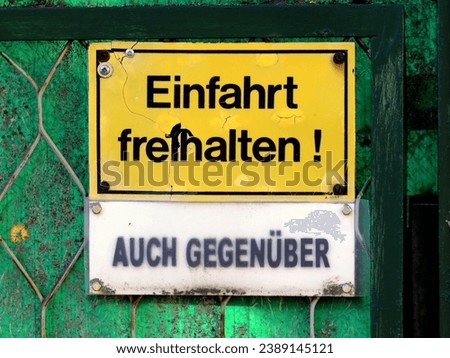 Similar – Image, Stock Photo Broken yellow exit sign made of plastic with black writing on brown wooden gate in the north end of Frankfurt am Main in Hesse