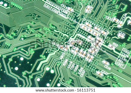 Am photo of the front side of green computer mother board.
