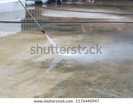 Similar – Image, Stock Photo Road worker cleaning city street with high pressure power washer, cleaning dirty public transport stops, Moscow, Russia