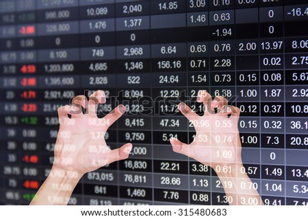 Reaching a hand.on stock market chart background,Hand feel Concept