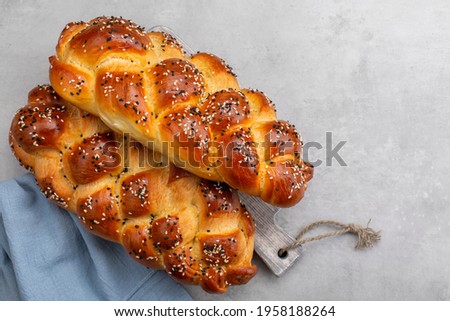 Homemade braided  Challah bread decorated with sesame seeds. Top view. Light grey background. Copy space. Stok fotoğraf © 