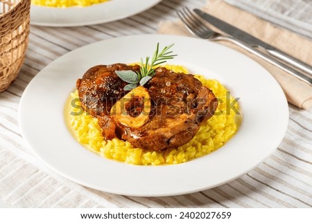 Similar – Rosemary on risotto with rabbit and mushrooms