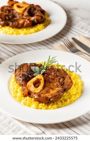 Similar – Rosemary on risotto with rabbit and mushrooms