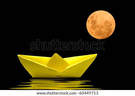Yellow paper boat on water with blurred moon behind