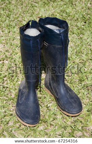 a pair of rain boots in the garden