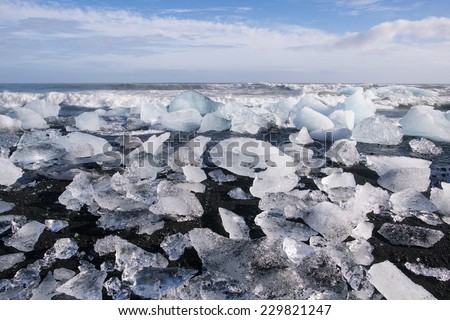 Ice blocks on a black sand beach near Jokulsarlon lagoon, Iceland