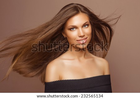 Portrait of Beautiful Woman with Long Hair and Clean Skin