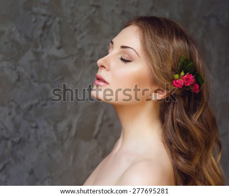 Portrait of Beautiful Young Woman. Healthy Long Wavy Hair, Clean Skin, Natural Make Up, Pink Lips and Clean Skin. Close Up