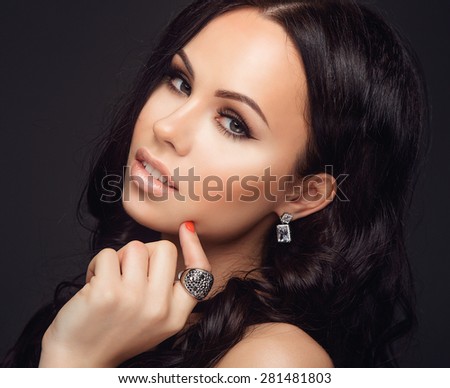 Portrait of Young Beautiful Woman with Fashion MakeUp, Long Hair, Clean Skin and Jewelry