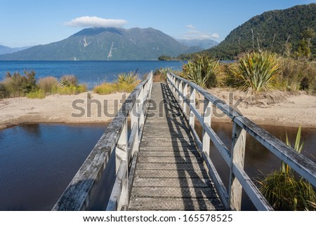 wooden bridge at lake Brunner, New Zealand