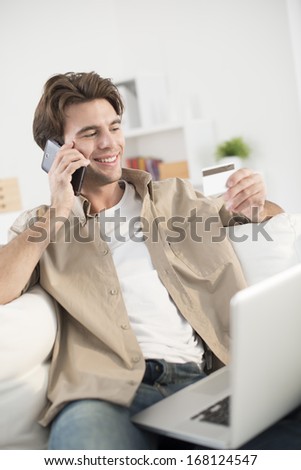 man at phone paying online ordering