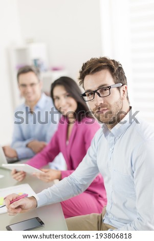 Portrait of a smiling businessman  in meeting