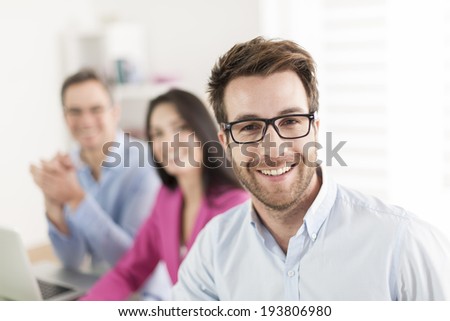 Portrait of a smiling businessman  in meeting