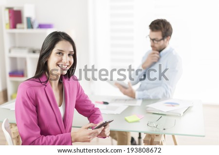 Portrait of a smiling businesswoman in meeting
