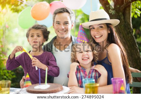 Birthday party in family. Four people family portrait.