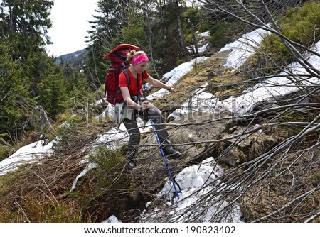 Hiker in mountains Carpathians overcome obstacles. Ukraine