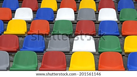 Colorful chairs in the stands at the stadium fans