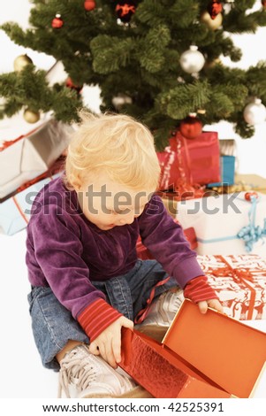 Wow - Surprised kid opening christmas presents