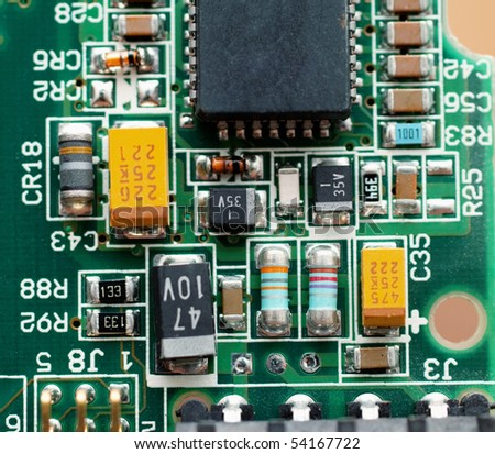 Closeup of chipset on green micro circuit board of computer