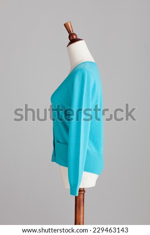 blue woman cashmere sweater with wood model on grey isolated