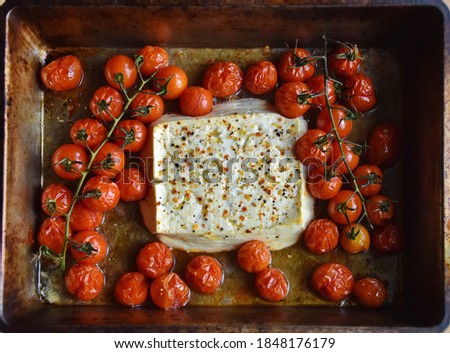 Baked feta pasta, or Tiktok pasta. Feta cheese and tomatoes in chilli and garlic oil. Use chili! In the oven it turns into an amazing pasta sauce by itself. Just add some cooked pasta, mix and enjoy. 