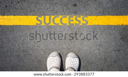 walking on yellow street lines concept of business success.