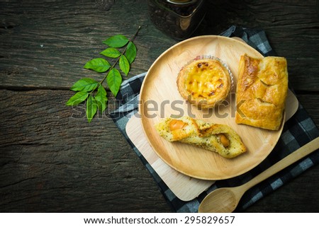 Bakery food place one wood dish wood spoon and green leaves on the old wood table concept  the fat that comes from food
