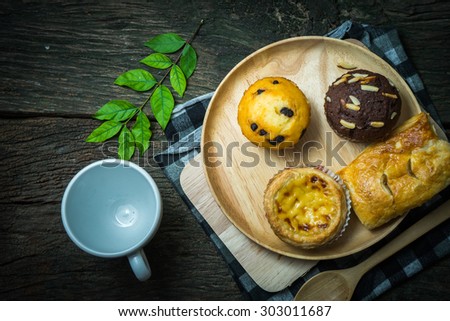Bakery food place one wood dish wood spoon and green leaves on the old wood table concept the fat that comes from food